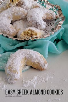 powdered sugar covered pastries in a basket on a table with teal napkin