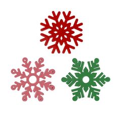 three different colored snowflakes on a white background