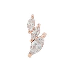 a pair of earrings with two pear shaped diamonds on each side and one diamond in the middle