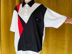 Awesome vintage bowling shirt from the 80s by ALAN STUART Mens size XL White polo-style bowling shirt with black collar & cool black & Red geometric shapes Excellent vintage condition with age-appropriate wear-please see all photos Retro Collared T-shirt For Streetwear, Retro Graphic Print Polo Collar Tops, Retro Red Polo Collar Top, Retro Short Sleeve Polo Shirt For Streetwear, Retro Graphic Print Short Sleeve Polo Shirt, Retro Black Collared Shirt, Retro Collared Shirt For Streetwear, Retro Collared Polo Shirt With Graphic Print, Bowling Vintage