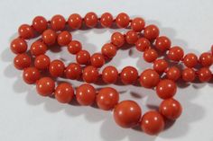 -Antique 14k Gold Natural Red Orange Coral Beaded Necklace -Total length: 24.5 in -Coral size: 5 mm ~ 11 mm -Clasp size: 12.3 mm x 10.3 mm x 7.65 mm (thickness) -Total weight: 35.6 g -Not perfectly round -The biggest bead have a small hole on it -Some have hairline cracks -Have a mark but cant see -Tested 14k gold Classic Orange Necklace For Formal Occasions, Classic Orange Necklaces For Formal Occasions, Orange Classic Formal Necklaces, Orange Classic Formal Necklace, Classic Orange Round Necklace, Classic Red Coral Formal Jewelry, Classic Red Gemstone Beads Necklace, Classic Red Necklace With Gemstone Beads, Classic Red Round Beaded Necklaces