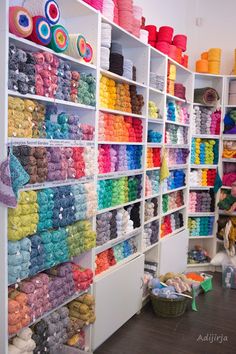 a room filled with lots of different types of yarn