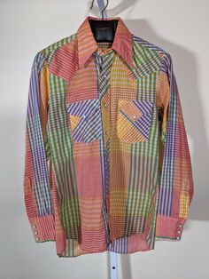 Ely Plains Rider Vintage 70s Western Multicolor Plaid Snap Button Shirt 33 | 15. Shipped with USPS First Class Package. Good vintage condition, light wear. Pit to pit: 19" Length: 28" Shoulders: 17" Shoulder to cuff: 24" Multicolor Retro Print Shirt For Fall, Retro Long Sleeve Patchwork Shirt, Colorful Retro Long Sleeve Tops, Colorful Long Sleeve Retro Tops, Retro Patchwork Shirt For Spring, Retro Multicolor Button-up Shirt, Colorful Retro Print Tops, Retro Cotton Shirt With Snap Buttons, Retro Long Sleeve Tops With Snap Buttons