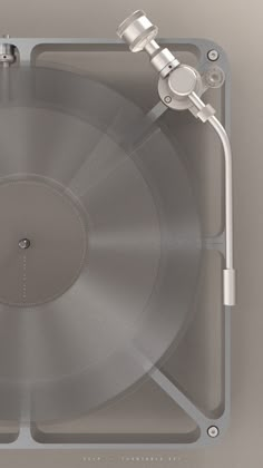 a silver record player sitting on top of a table