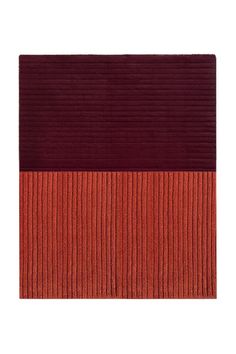 an orange and red rug on a white background, with the color block in the middle