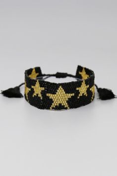 Adjustable star beaded bracelet. Black and gold, Adjustable Black Beaded Friendship Bracelets, Black Bracelets With Tiny Beads For Party, Adjustable Black Friendship Bracelets For Party, Adjustable Black Bracelets With Gold Beads, Gold Friendship Bracelets With Black Round Beads, Trendy Gold Beaded Braided Bracelets, Adjustable Black Friendship Bracelet With Colorful Beads, Adjustable Black Friendship Bracelets With Tiny Beads, Adjustable Black Wristband With Colorful Beads