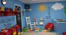 a child's room with blue walls and lots of toys