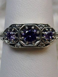 Art deco style ring with three Purple amethyst CZs set in sterling silver filigree Art Deco Jewellery Design, Vintage Jewellery Rings, Gems Art, 3 Stone Rings, Ring Art Deco, North South, Cubic Zirconia Rings, Deco Jewelry, Filigree Ring