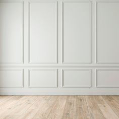 an empty room with white walls and wood flooring is shown in this image, there is