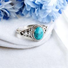 Elevate your style with our Sterling Silver Turquoise Ring, a beautifully handcrafted piece that combines classic elegance with vibrant color. This stunning ring features a genuine turquoise stone set in high-quality sterling silver, making it a unique addition to any jewelry collection. Key Features: Genuine Turquoise: A natural turquoise stone known for its striking blue-green hue and unique matrix patterns. Turquoise is celebrated for its beauty and is believed to bring calm and positivity. S Handmade Turquoise Jewelry For Promise Ring, Spiritual Turquoise Ring As A Gift, Bohemian Turquoise Promise Ring, Elegant Turquoise Ring Gift, Artisan Turquoise Ring As A Gift, Artisan Style Turquoise Ring As A Gift, Adjustable Turquoise Ring With Birthstone, Adjustable Turquoise Ring Gift, Handmade Adjustable Elegant Turquoise Ring