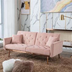 a living room scene with focus on the couch and rugs in the foreground