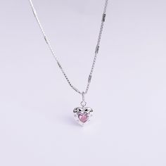 Introducing our Pink Glam Heart Necklace - crafted in Sterling Silver with a heart-shaped pink crystal at its core. This unique chain necklace features a sparkling pink crystal heart pendant, on a Sterling Silver heart shape base adding sophistication to any look. Wear it long or short with the adjustable clasp. Elevate your style with this enchanting piece that radiates love and glamour. Main Stone: heart shaped lab diamond Stone Color: pink Metal Material: 925 Sterling Silver Chain Lenght: 16 Silver Heart-shaped Crystal Necklace With Clavicle Chain, Pink Heart Charm Round Pendant Jewelry, Pink Round Pendant With Heart Charm, Pink Round Pendant Jewelry With Heart Charm, Silver Heart Crystal Necklace, Crystal Heart Jewelry With Heart Charm, Silver Crystal Clavicle Necklace With Heart Pendant, Heart Charm Crystal Jewelry, Valentine's Day Heart Pendant Crystal Necklace