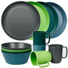 a set of green and blue dishes with cups