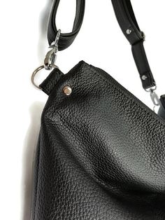 Crossbody black purse Black crossbody bag Crossbody vegan purse Black bag purse Black handbag Women black bag Crossbody vegan bag Black bag Cross body bag Cross body purse Women black purse Small crossbody bag Black purse This is medium size bag.Shoulder purse.Its simple and functional character allows you to fit everything you need inside throughout your entire day. It is voluminous yet neat, making it a great addition to a loose fitting and elegant clothing. This full zipped up bag is made for Versatile Black Satchel In Clutch Shape, Black Shoulder Bag With Adjustable Handle For Everyday Use, Black Clutch Shoulder Bag For Everyday Use, Versatile Black Hobo Bag With Adjustable Handle, Black Clutch Bag For Everyday Use, Everyday Black Clutch Shoulder Bag, Modern Black Crossbody Hobo Bag, Black Satchel Backpack With Detachable Handle, Black Satchel With Detachable Handle Backpack Shape