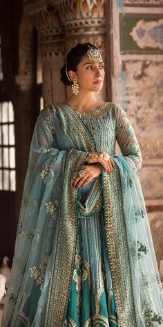 Pakistani Wedding Dress in Blue Pishwas Trouser Style has an alluring blue color. Lavish designs and hand-crafted details of embroidery make this beautiful Pishwas Dress an epitome of beauty and your priority to have a head-turning look on the big day. Blue Dress Design Pakistani, Blue Wedding Dress Pakistani, Blue Pakistani Dress, Ice Blue Bridal Dress Pakistani, Sapphire Dresses Pakistani, Wedding Dresses Pakistani, Pakistani Designer Clothes, Raw Silk Fabric, Pakistani Wedding Dress