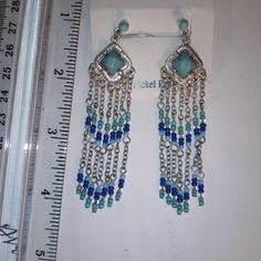 Chaps Fashion Jewelry, Turquoise/Silver Earrings New, Never Used. Sku: 0069 Blue Metal Beaded Dangle Earrings, Blue Drop Earrings With Silver Beads, Blue Beaded Metal Chandelier Earrings, Blue Dangle Earrings With Silver Beads, Blue Metal Chandelier Earrings With Dangling Beads, Blue Earrings With Silver Beads, Blue Beaded Chandelier Earrings, Blue Chandelier Earrings With Dangling Beads, Blue Nickel-free Dangle Chandelier Earrings