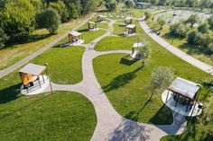 an aerial view of a park with trees and benches