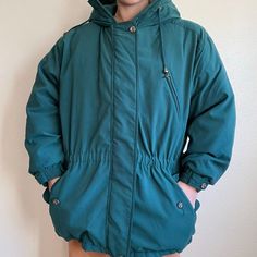 Vintage 90s Eddie Bauer Womens Premier Polar Parka Goose Down Puffer Jacket XXL Size XXL Color: green with a blue undertone  Zipper & button front closure  Goose down filler  Hooded (does NOT come with fur trim) 2 front pockets  1 breast pocket  Super fluffy and heavy weight  Modeled on a medium/ size 6/ 5 foot 7/ 140lbs/ 34 C Collar to hem: 34"  Pit to pit: 28"  Sleeve: 22" Green Winter Outerwear With Button Closure, Casual Green Outerwear For Cold Weather, Green Outerwear With Pockets For Cold Weather, Vintage Green Outerwear For Cold Weather, Green Buttoned Outerwear For Outdoor, Green Outdoor Outerwear With Buttons, Vintage Green Hooded Outerwear, Green Hooded Vintage Outerwear, Green Outerwear With Button Closure For Outdoor