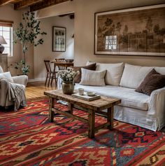 a living room filled with furniture and a rug