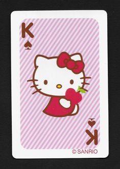 a hello kitty playing card with an apple in its mouth and the letter k on it