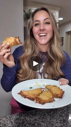 a woman sitting at a table eating food