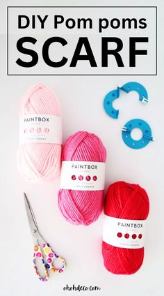 three balls of yarn and scissors on a white surface with the text diy pom poms scarf