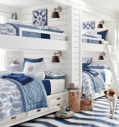 a bed room with bunk beds and pillows on the bottom shelf next to each other