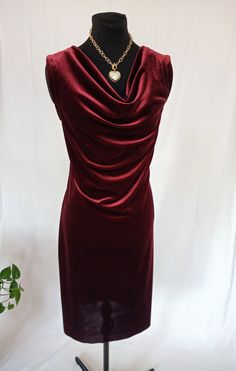 Velvet dress. Great for Parties or business related events. Knee length or below the knee dress. Fitted waist. Please provide your measurements for a custom fit. Chic Sleeveless Velvet Midi Dress, Sleeveless Velvet Midi Dress For Formal Occasions, Formal Sleeveless Velvet Midi Dress, Elegant Sleeveless Velvet Midi Dress, Elegant Draped Velvet Dress, Elegant Sleeveless Velvet Dress For Formal Occasions, Sleeveless Velvet Midi Party Dress, Sleeveless Velvet Midi Dress For Party, Elegant Ruched Velvet Mini Dress