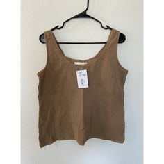 This Becasa Blouse Is Perfect For Any Casual Occasion. The Round Neck And Sleeveless Design Make It Comfortable And Cool To Wear On A Hot Summer Day. It Is Made Of 100% Cotton And Is Machine Washable. The Fringe Accents Add A Trendy Touch To This Solid Tan Colored Blouse, Which Is Cropped And Has A Loose Fit. The Blouse Is Available In Size Medium And Is From The Usa. It Is Made Of Linen Material And Is Easy To Care For. The Blouse Is Suitable For Women Of All Ages And Can Be Paired With Jeans O Sleeveless Brown Cotton Blouse, Brown Sleeveless Cotton Blouse, Beige Cami Vest Top, Casual Beige Sleeveless Camisole, Beige Vest Top For Vacation, Brown Casual Sleeveless Tank Top, Casual Brown Sleeveless Tank Top, Brown Tank Vest Top, Sleeveless Brown Cotton Top