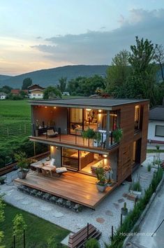 a modern house in the middle of a green field