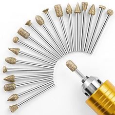 gold and silver nail polishing tools arranged in a circle