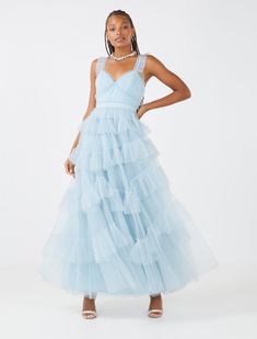 Romantic evening gown crafted from a dreamy tulle. Topped with a fitted bodice and a tiered, full ruffle skirt. 100% polyester Dry clean Tulle Ruffle Dress, Miniature Clothes, Dance Proposal, 2023 Prom, Tiered Ruffle Dress, Body Balm, Romantic Evening, Dress Inspo, Gothic Dress