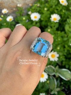 Thank you for coming in! Impressive blue aquamarine Platinum vintage diamond ring with a fancy diamond setting. Ring Size: 6 Total Weight: 14.03 grams Precious Metal: Platinum Precious stones: -Aquamarine Center Stone: 18.5 carats, 18.7mmx15.5mm -White Round Diamonds: 0.6 carats, QTY: 20 Formal Light Blue Diamond Ring, Aquamarine Brilliant Cut Diamond Ring For Formal Occasions, Formal Aquamarine Diamond Ring With Brilliant Cut, Luxury Blue Diamond Ring With Accents, Formal Aquamarine Diamond Ring With Prong Setting, Luxury Blue Topaz Ring With Diamond Accents, Formal Light Blue Aquamarine Diamond Ring, Light Blue Diamond Jewelry With Accent Stones, Formal Aquamarine Diamond Ring With Gemstone