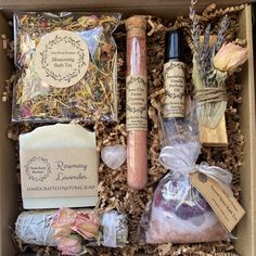 an open box containing soaps, candles, and other items in the same package