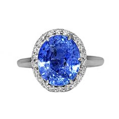 A Breathtakingly Striking  HANDMADE 14k White Gold Ring with Beautiful Oval cut Sapphire in Blue color! The GEM is 5.87 CT and measures 11.07x9.24x6.82 mm! This Stone will take your breath away, especially on the sunlight! You will want to look at this stone endlessly. The mounting is a masterpiece! HANDMADE 14K White Gold Mounting (tested), that was is custom made to Accommodate this Beauty of a Gem in Prongs setting! Super FINE Workmanship on the Diamond prong  setting with 22 pcs Brilliant Full Cut Diamonds in GH color, SI1 clarity, totaling to approx 0.38 ct ! Fabulous Braided Band and Diamond Gallery! The Entire Top's outline is 13.7x12.3 mm- HUGE. The Ring weights 5.3 g, nice and SOLID. Sits 8.2 mm off the top of the finger. Finger size 7 (Free Re-sizing with purchase). Center Stone: Blue Oval Gia Certified Halo Ring, Elegant Blue Oval Halo Ring, Luxury Sapphire Oval Halo Ring, Luxury Oval Sapphire Halo Ring, White Gold Oval Sapphire Ring, Oval Sapphire Halo Ring With Brilliant Cut, Oval Sapphire Diamond Ring With Brilliant Cut, Oval Brilliant Cut Sapphire Ring, Oval Sapphire Ring With Halo Design