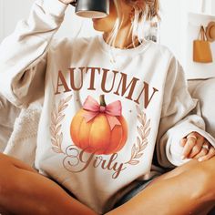 Enjoy the cozy vibes of autumn with our Cozy Pumpkin Spice Shirt! This women's fall crewneck is perfect for the season, featuring a cute pumpkin design that captures the essence of autumn. Made from soft, high-quality fabric, this pumpkin sweatshirt offers warmth and style, making it a must-have for your fall wardrobe. Whether you're sipping on your favorite coffee, enjoying Halloween festivities, or just relaxing at home, this autumn coffee sweater will keep you comfortable and stylish. The gir Cute Long Sleeve Fall Sweatshirt, Cute Long Sleeve Sweatshirt For Fall, Cute White Fall Sweatshirt, Cute Fall Letter Print Sweatshirt, Cute White Sweatshirt For Fall, Cute Letter Print Sweatshirt For Fall, Cute Graphic Print Sweater For Fall, Pumpkin Patch Photoshoot, Girly Halloween