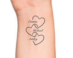 two hearts with the words camera michael and sidney on their wrist tattoo designs for women