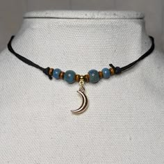 Blue Ceramic Wood Beaded Gold Moon Charm Boho Hippie Adjustable Black Rope Cord Choker Stacking Necklace Comes On An Adjustable Waxed Black Cord Necklace. Necklace Is Adjustable From Approximately 13" To 22". Wood Beads Necklace, Festival Jewelry With Blue Moon Charm, Blue Jewelry With Moon Charm For Festival, Handmade Hippie Blue Jewelry, Blue Festival Jewelry With Moon Charm, Festival Blue Jewelry With Moon Charm, Adjustable Bohemian Beaded Necklace With Moon Charm, Blue Hippie Beaded Necklaces, Handmade Black Hippie Necklaces