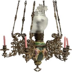 an ornate chandelier with candles hanging from it