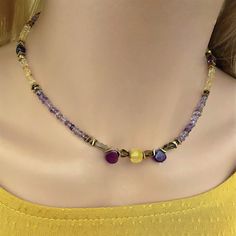 Mixed gemstone beaded necklace choker. Nice combination of natural stones original small button shapes citrine and amethyst (3mm.) with 18k. gold filled beads.  Central stones of necklace in citrine and amethyst briolette. This statement necklace will bring a nice original and colorful touch to your outft. Necklace assembled on a very durable jewelry wire. Adjustable length 15.4inch. + 2 in. extension chain. Nickel-free stainless steel lobster clasp. Yellow Gemstone Beaded Necklaces As Gift, Yellow Gemstone Beaded Necklace For Gifts, Citrine Gemstone Beads For Jewelry Making, Purple Colorful Beads Choker Jewelry, Purple Colorful Beaded Choker Jewelry, Multicolor Amethyst Gemstone Beaded Necklaces, Multicolor Adjustable Amethyst Necklace, Yellow Gemstone Beads For Jewelry Making, Multicolor Beaded Amethyst Necklaces