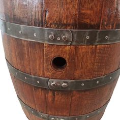 an old wooden barrel with metal straps and rivets on the bottom, isolated against a white background