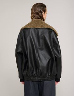 Removable fur collar leather bomber jacket . 100% faux leather 100% polyester lining Faux fur collar is removableZip pockets Elastic bottom hem Small- chest 38" length 25"Small- chest 40" length 25"Medium -chest 42" length 26"Large- chest 44" length 26"Model wears size S and is 5.9"/172 cmImported Fall Leather Jacket With Contrast Collar, Shearling Leather Jacket With Faux Fur Trim For Work, Fall Shearling Biker Jacket With Padded Collar, Fall Shearling Fur Coat With Padded Collar, Leather Jacket With Contrast Collar For Winter, Fall Shearling Leather Jacket With Faux Fur Trim, Leather Outerwear With Ribbed Collar For Fall, Collared Leather Winter Outerwear, Winter Leather Fur Coat With Padded Collar