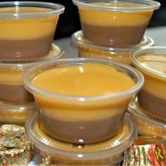 there are many small cups with sauces in them