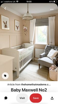 a baby's room with pink walls and white furniture