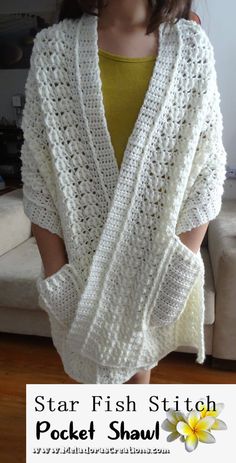 a woman wearing a white knitted shawl with text that reads star fish stitch pocket shawl