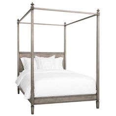 an iron bed frame with white sheets and pillows on it, against a white background