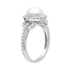 Exquisite elegance. A freshwater cultured pearl framed by cubic zirconia stones gives this ring stunning beauty. Add a sophisticated touch to any ensemble when you wear this sterling silver ring. Exquisite elegance. A freshwater cultured pearl framed by cubic zirconia stones gives this ring stunning beauty. Add a sophisticated touch to any ensemble when you wear this sterling silver ring. Cubic zirconia stones accenting the band add extra sparkle. 8.5-9-mm cultured pearl .45-in. width Metal: ste Anniversary Pearl Ring With Halo Setting And Cubic Zirconia, Anniversary Pearl Ring With Halo Setting, Right Hand Rings, Cubic Zirconia Rings, Vintage Style Outfits, Sterling Silver Ring, Fresh Water, Silver Ring, Sterling Silver Rings