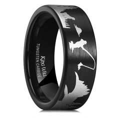 a black and white wedding ring with dinosaur silhouettes on it