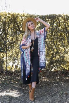 **This product is shipped by a third party warehouse within the US and may arrive separately from your complete order. This kimono is perfect for a fun summer day. The vibrant colors and floral pattern will make you feel cheerful and stylish. The light fabric is perfect for hot weather, and the loose fit ensures that you'll be comfortable all day long. #completeyourlook #lovemyleto Imported Summer Patterned Kimono For Beach Cover-up, V-neck Patterned Kimono For Festival, Casual Patterned Kimono For Beach Cover-up, Red One-size Kimono For Festivals, Multicolor Summer Kimono For Beach Cover-up, Red Kimono For Beach Cover-up, Casual Multicolor V-neck Kimono, Summer V-neck One Size Kimono, Hippie Open Front Kimono For Spring