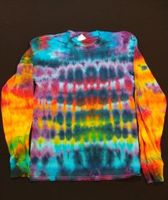 a long sleeved shirt with multicolored tie dye